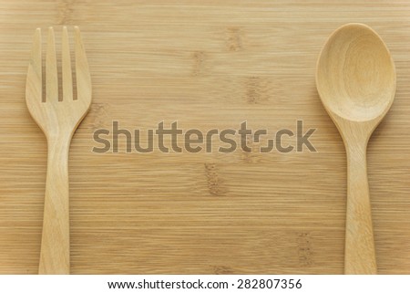 wood  spoon and fork on wood background