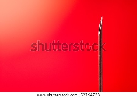 medical syringe with a needle on the white isolated background