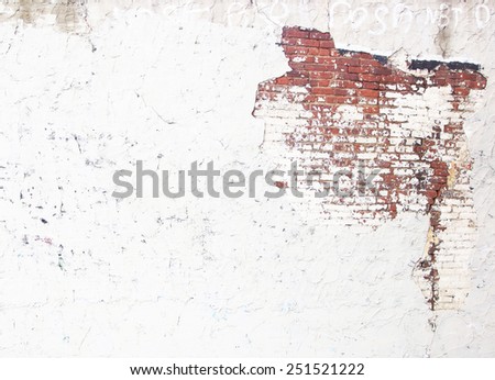 plastered wall with exposed brick wall
