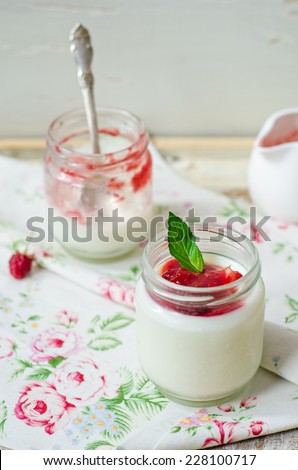 Yogurt with strawberry and berry sauce