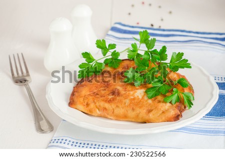 Chebureki - fried  pies with meat in white plate on wooden background