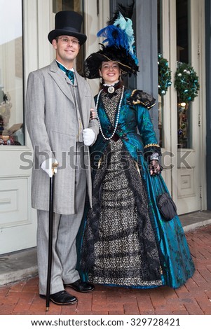 Galveston, TX/USA - 12 06 2014: Smiling couple dressed in Victorian style at Dickens on the Strand Festival in Galveston, TX
