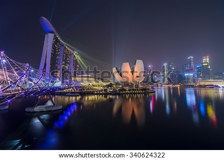 SINGAPORE, SINGAPORE - CIRCA SEPTEMBER 2015: Singapore city lights, ArtScience Museum, Marina Bay Sands and Helix Bridge at night, Singapore