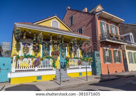 Old Colonial Houses on the Streets of French Quarter decorated for Mardi Gras in New Orleans, Louisiana