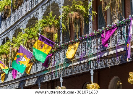 Ironwork galleries on the Streets of French Quarter decorated for Mardi Gras in New Orleans, Louisiana