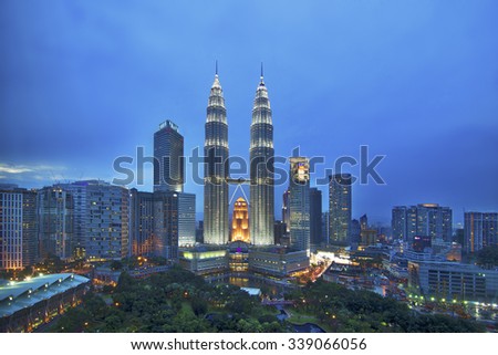 KUALA LUMPUR - NOV 15 : The Petronas Twin Towers on November 15 , 2015, in Kuala Lumpur, Malaysia are the world\'s tallest twin tower. The skyscraper height is 451.9m