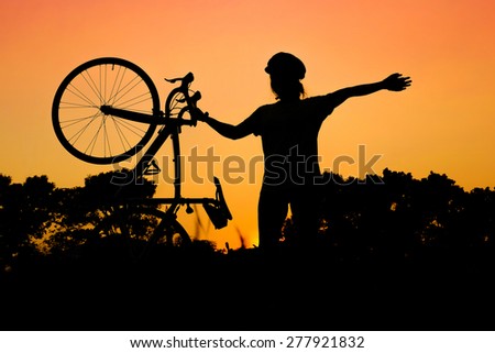 woman and road bike silhouette