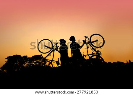 two girl and road bike silhouette