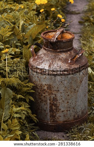 Antique rusty canister, toned image. Selective focus