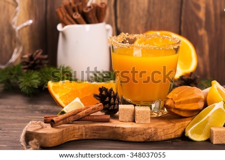Orange drink with spices. Christmas or New Year background. Selective focus