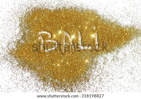 Inscription Bali on golden glitter sparkle on white background