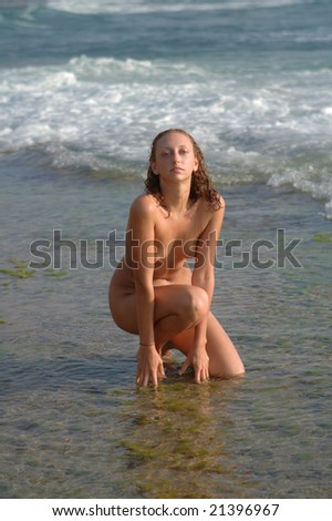 stock photo Beautiful nude girl at the beach