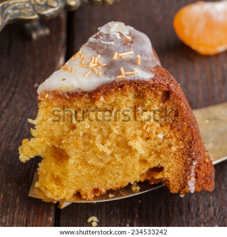 A piece of tangerine cake with vanilla glaze