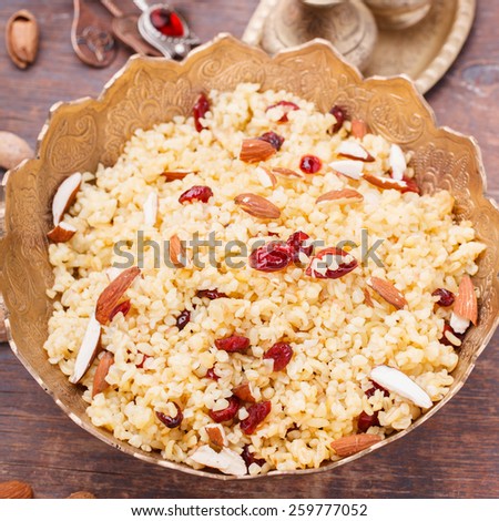 Bulgur with dried cherries and almonds.selective focus