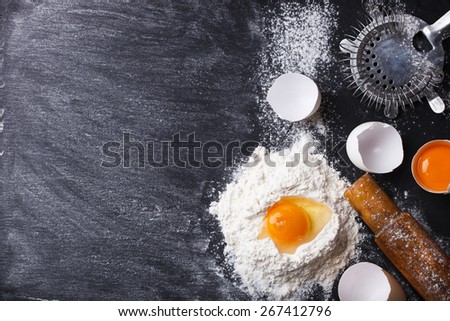 Baking background with eggshell,  flour and rolling pin .selective focus..Copy space.