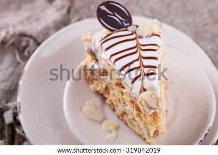 Traditional Hungarian Esterhazy cake .selective focus .Esterhazy cake with chocolate piece with a name of the cake: \