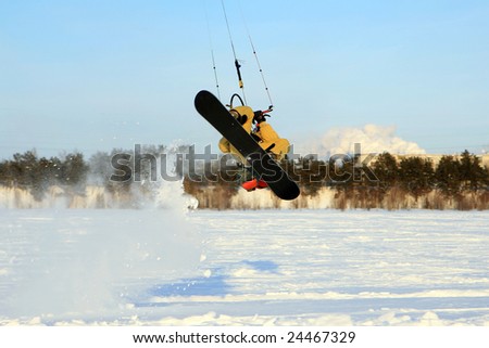 Winter sports. Ski kiting on a snowy river.