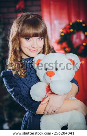 smiling girl with a toy