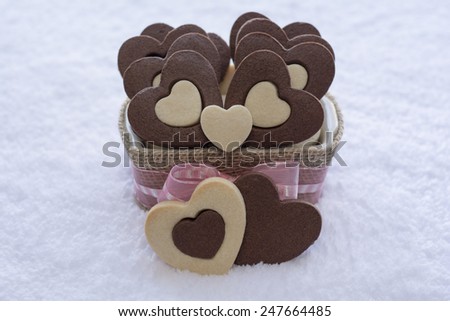 Pretty Rolled Vanilla Heart inside Chocolate Heart Sugar Cookies in a Ceramic bowl wraps with Burlap