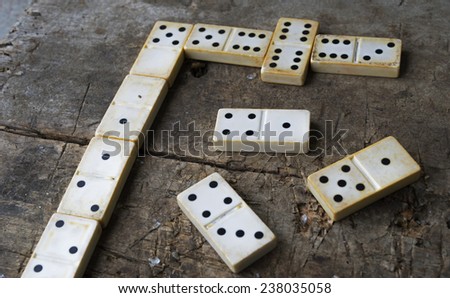 Old domino game on wood background