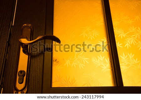 The handle of the old door in dark room