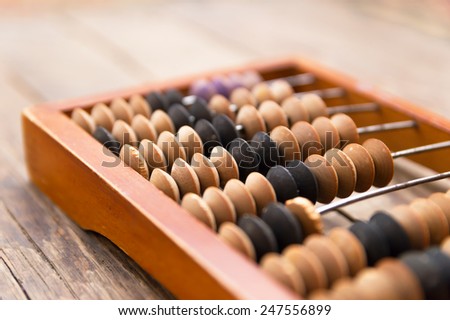 Old wooden abacus on wood background Old wooden abacus on wood background