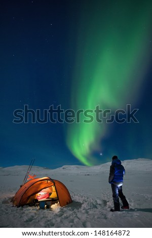 Campground on a Winter expedition with northern lights