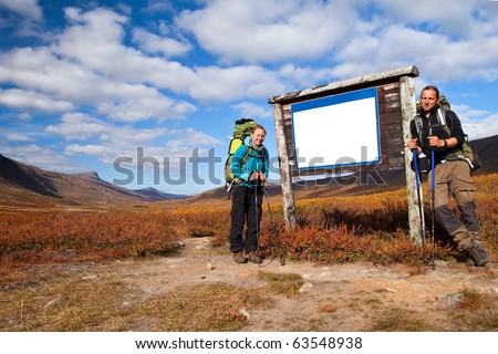 a couple of long distance hiker on a empty label in autumn