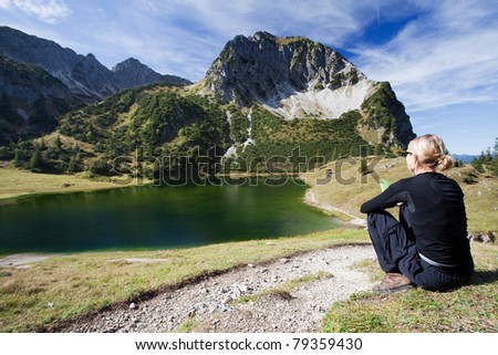 Female hiker in the German Alps have a break on the Foot of the Rubihorn