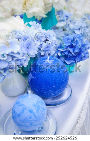 blue wedding table decoration with hydrangeas and candles