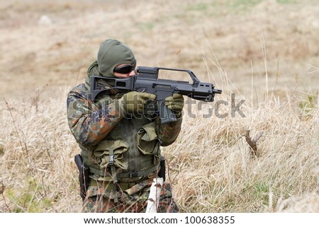 shooting soldier with attack rifle