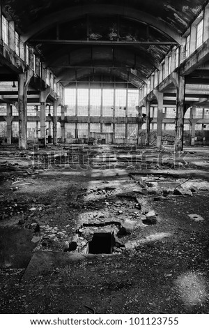 big production hall in the abandoned factory, black and white