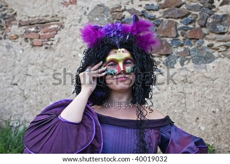woman in historical costume with mask