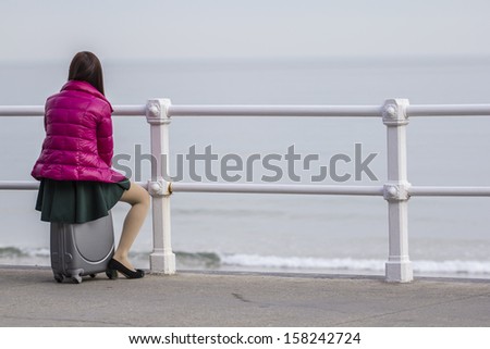 Woman with suitcases