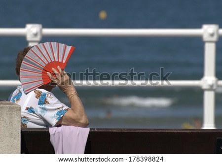 old woman with fan