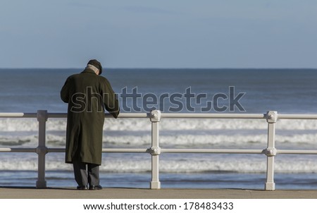 Old man with coat and hat