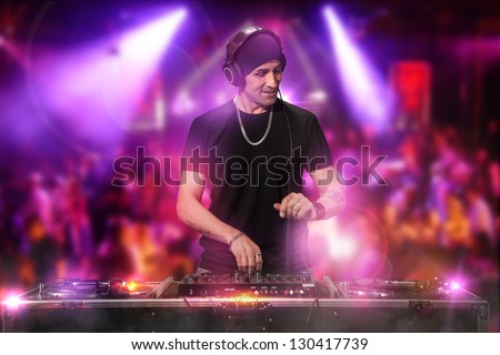 Photo of dj working at the disco