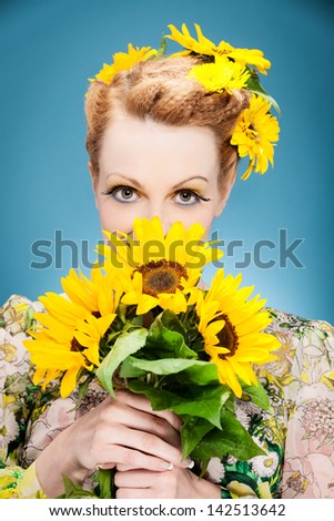 Photo of fresh summer makeup with sunflowers in the head