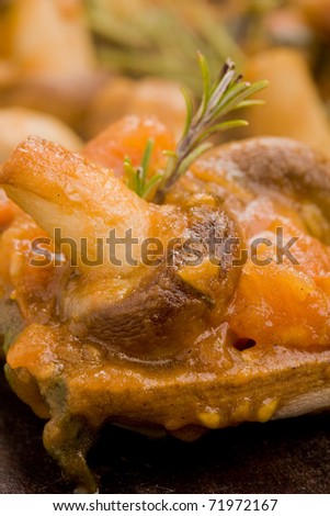 photo of cooked mushrooms with fresh tomatoe and rosemary