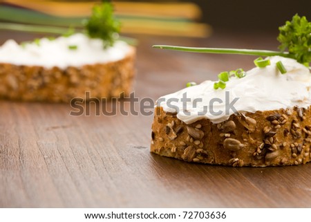 photo of delicious crispy cereals bread with creme fraiche