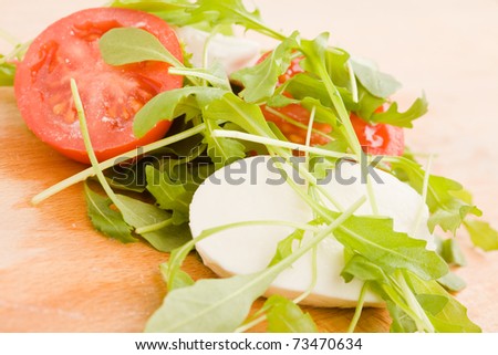 photo of rocket salad with tomato and mozzarella