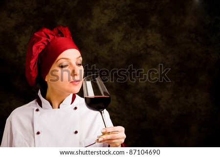photo of young successful female chef with rolling pin in her hands