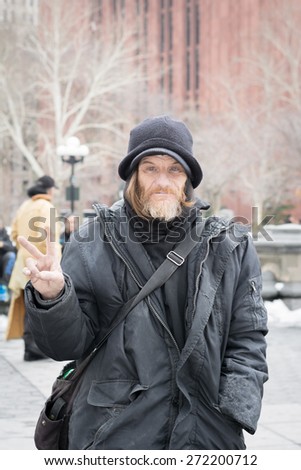 NEW YORK CITY - MARCH 8th 2015: Birdman of Washington Square Park/ Larry feeds birds and pigeons at the park