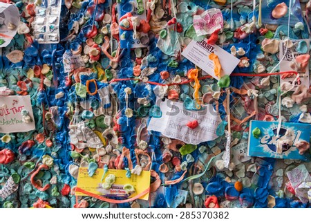 SEATTLE May 15th 2015: A Gum Wall background in downtown Seattle. It is a local landmark in Post Alley under Pike Place Market, Seattle Washington