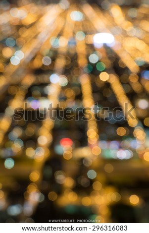 Abstract blurred bokeh of city skyline and traffic lights at night in big city for background usage