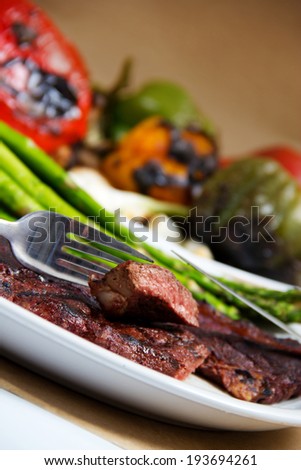 Stock image of grilled steak and veggies