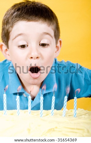 Boy Blowing Candles