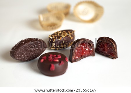 Chocolate Candies with Wrappers on a White Background
