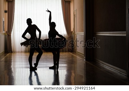 ballet dancers training in the hall silhouette