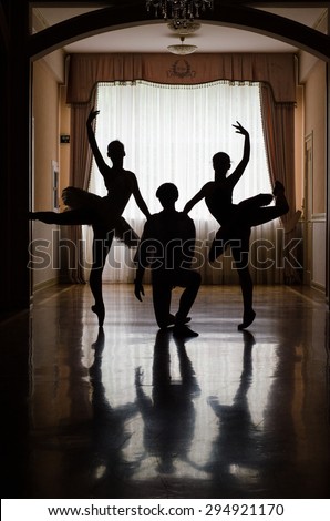 ballet dancers training in the hall silhouette
